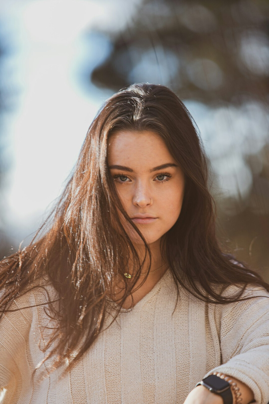 Portrait of a young woman with long hair smiling