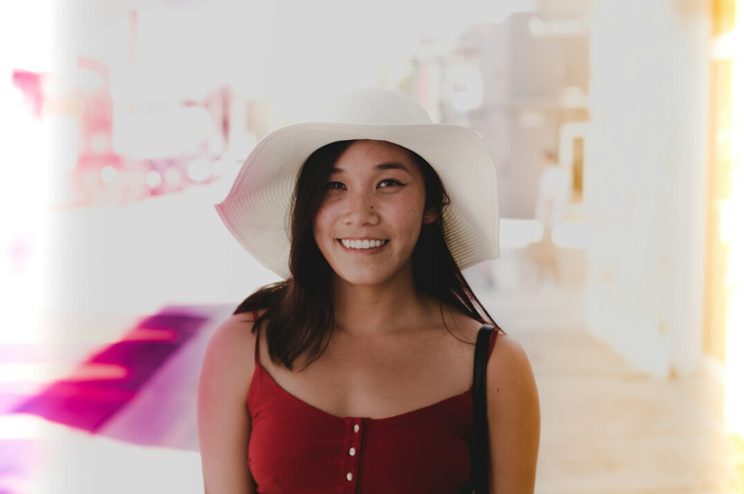 Smiling young Latina woman looking at the camera in a bright setting